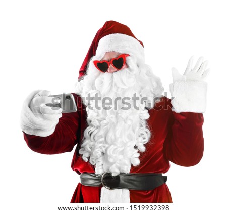 Authentic Santa Claus taking selfie on white background