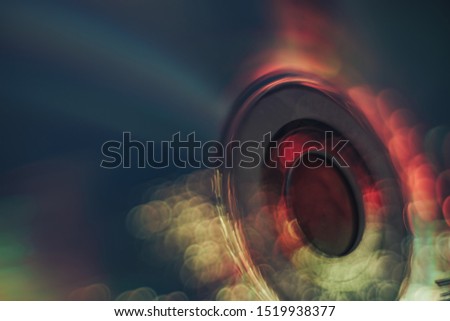 Beautiful abstract  disk with multi colored shine light background.