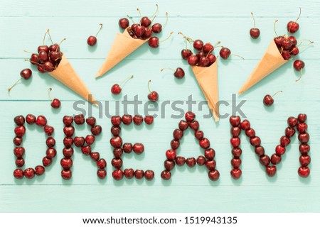 dream, word, berries, wooden background, white vignetting