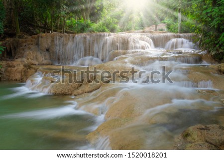 Beautiful mountain waterfall landscape in the nature autumn forest in north of Thailand. Maekae or Kaofu waterfall river scene.
