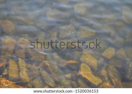 Rocks in clean beach - image