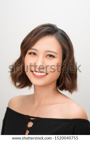 Close up of young Asian beautiful woman with smiley face.