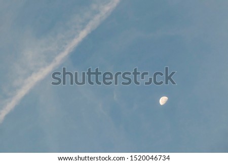 close up half moon at blue sky