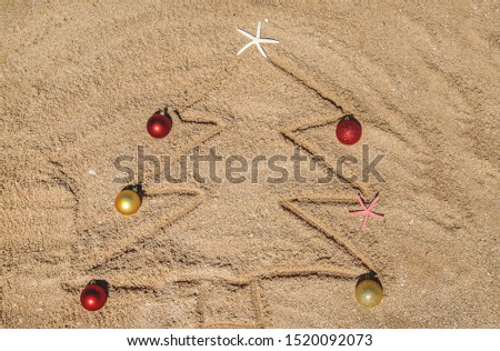 Christmas tree made of shells in the sand. Selective focus. nature.