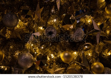 Close up of Christmas golden decoration with sparkles, lights and copy space