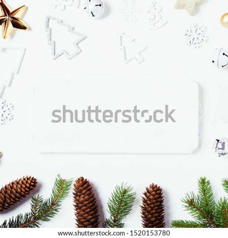 Christmas decorations   on white textured background, Xmas holidays greeting card with copy space at centre.