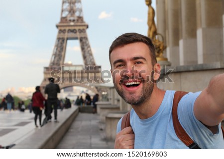 Cute tourist taking a selfie in France 