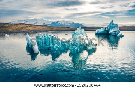 Only by drone you can make so close picture of icebergs in Jokulsarlon Glacier Lagoon. Amazinf summer scene of Vatnajokull National Park. Splendid morning scene of Iceland, Europe. 