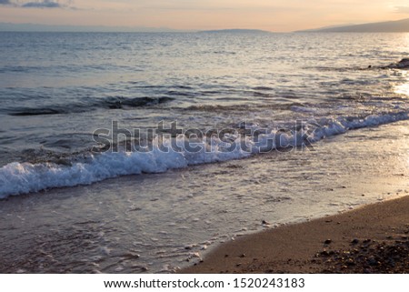 Beautiful coastline with stones and water. blue sea wave photograph close up. vacation at sea or ocean. Background to insert images and text.