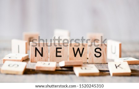 News text wooden blocks concept