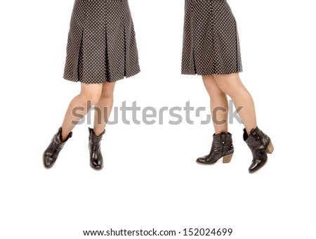 Woman Wearing Polka Dot Mini Skirt and Black Leather Cowboy Boots Isolated