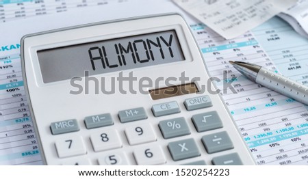 A calculator with the word Alimony on the display Royalty-Free Stock Photo #1520254223