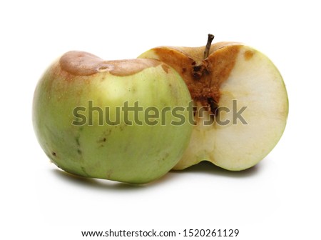Rotten apple sliced in half isolated on white background Royalty-Free Stock Photo #1520261129