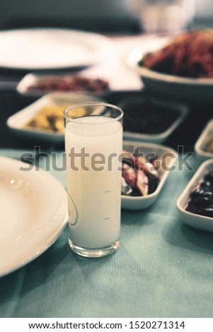 Turkish and Greek Traditional Dinning Table with Special Alcohol Drink Raki. Ouzo and Turkish Raki is a dry anise flavoured aperitif that is widely consumed in Turkey, Greece, Cyprus and Lebanon