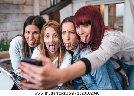Group of young women vloggers take a selfie during a live - Millennials have fun together