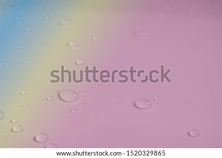                   water drop on pink pastel background             