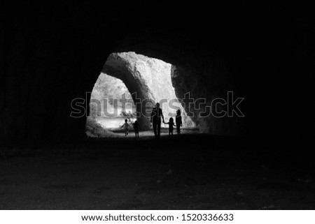 Family walking in stranger rocks in Bulgaria
