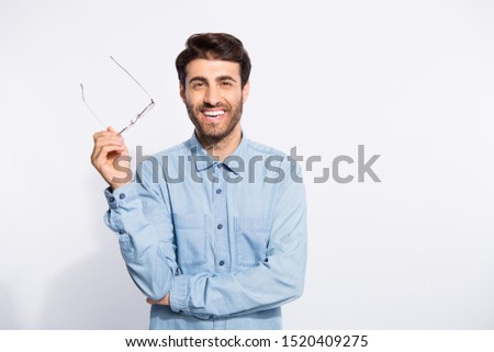Photo of multiethnic clever guy lecturer holding specs in hand listening students exam reports wear casual denim shirt isolated white color background