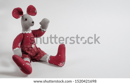 
toy mouse in red christmas costume