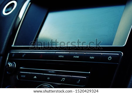 Panel of a new car. Black shiny details in a car. Auto interior design.