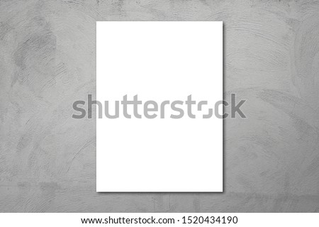 White poster on concrete wall. or blank paper labels on the cement wall.Information promoting ideas for marketing announcements and details.