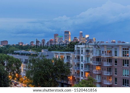 A Blue Hour Cityscape Shot of the Minneapolis Skyline over Uptown High Rise Apartments during a Summer Evening