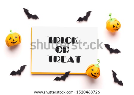 Trick or treat. Happy Halloween holidays concept with pumpkins and text on white background