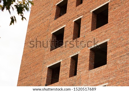 Empty forgotten brick high building