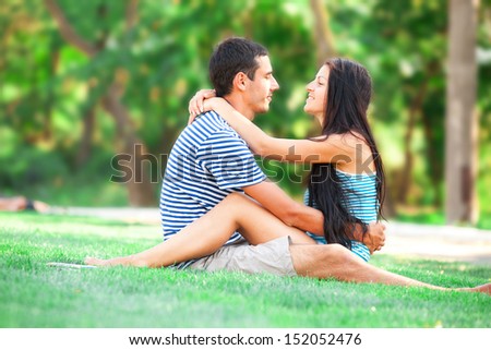 Young teen couple kissing at outdoor