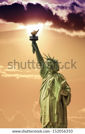 Side view of the Statue of Liberty with beautiful sky.