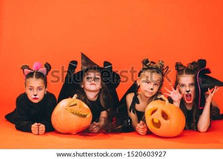 Group of girls dressed in halloween costumes