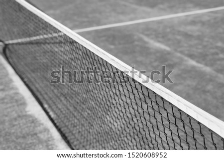 black and white Photo of tennis net at court