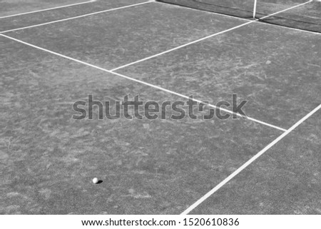 Black and White photo of Tennis ball on court