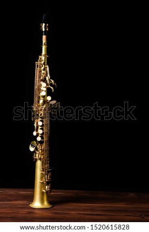 soprano saxophone on black background Royalty-Free Stock Photo #1520615828