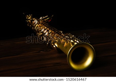 soprano saxophone on black background Royalty-Free Stock Photo #1520616467