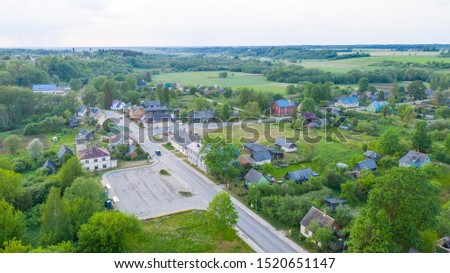Aerial view from drone on Akniste in Latvia. Beautiful landscapes on small town fields and forests.