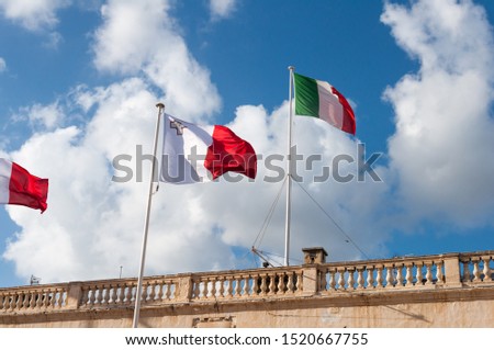 malta and italy flag in wind