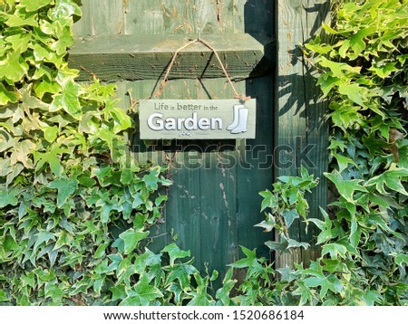 Life is better in the garden board with ivy leaves