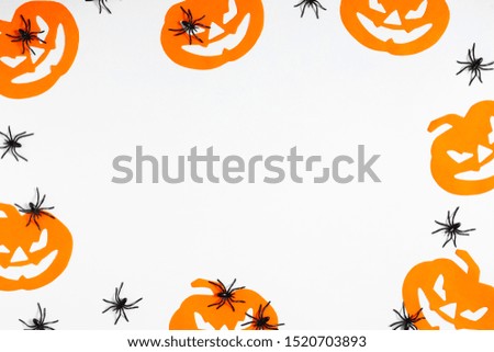 Halloween decorations concept. Halloween with black spiders and pumpkin on white background. Flat lay, top view, copy space