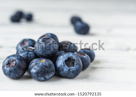 Close up of fresh organic blueberries on white background