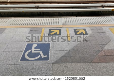 Disable Icon Sign or Wheelchair icon on foot path for Handicap person in Train Subway Station
