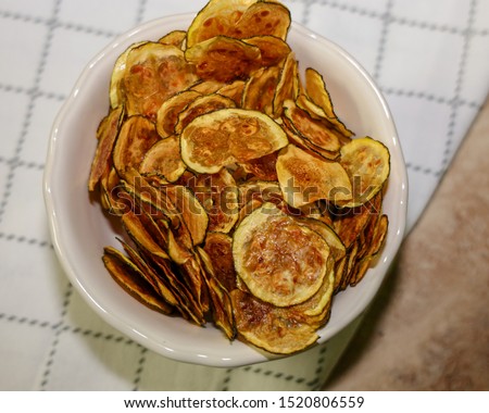 Ketogenic zucchini chips in a bowl. Chips for keto diet.