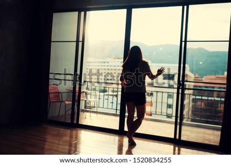 beautiful scene single woman looking at sunset ,strong woman life .