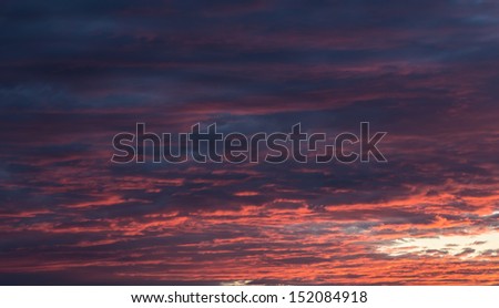  Sunset with red and orange clouds. 