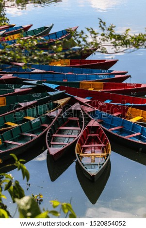 Traditional water boat kept aside of Phewa lake, Pokhara, Nepal