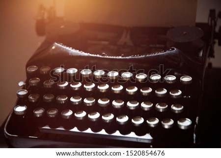 Antique typewriter. Vintage typewriter machine closeup photo.