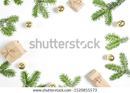 Christmas or winter composition. Handmade gift boxes decorated with craft paper of fir tree branches, on white background. Flat lay, top view, copy space