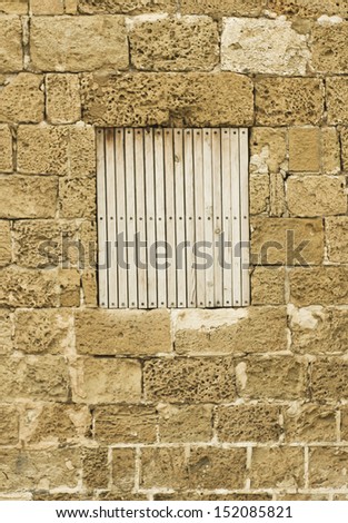 The window of the old house driven in by boards