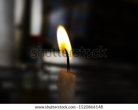 The abstract art design background of Candle light on background,blurry light around,sign and symbol of spirit