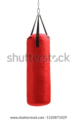 Studio shot of a red punching bag hanging isolated on white background Royalty-Free Stock Photo #1520871029